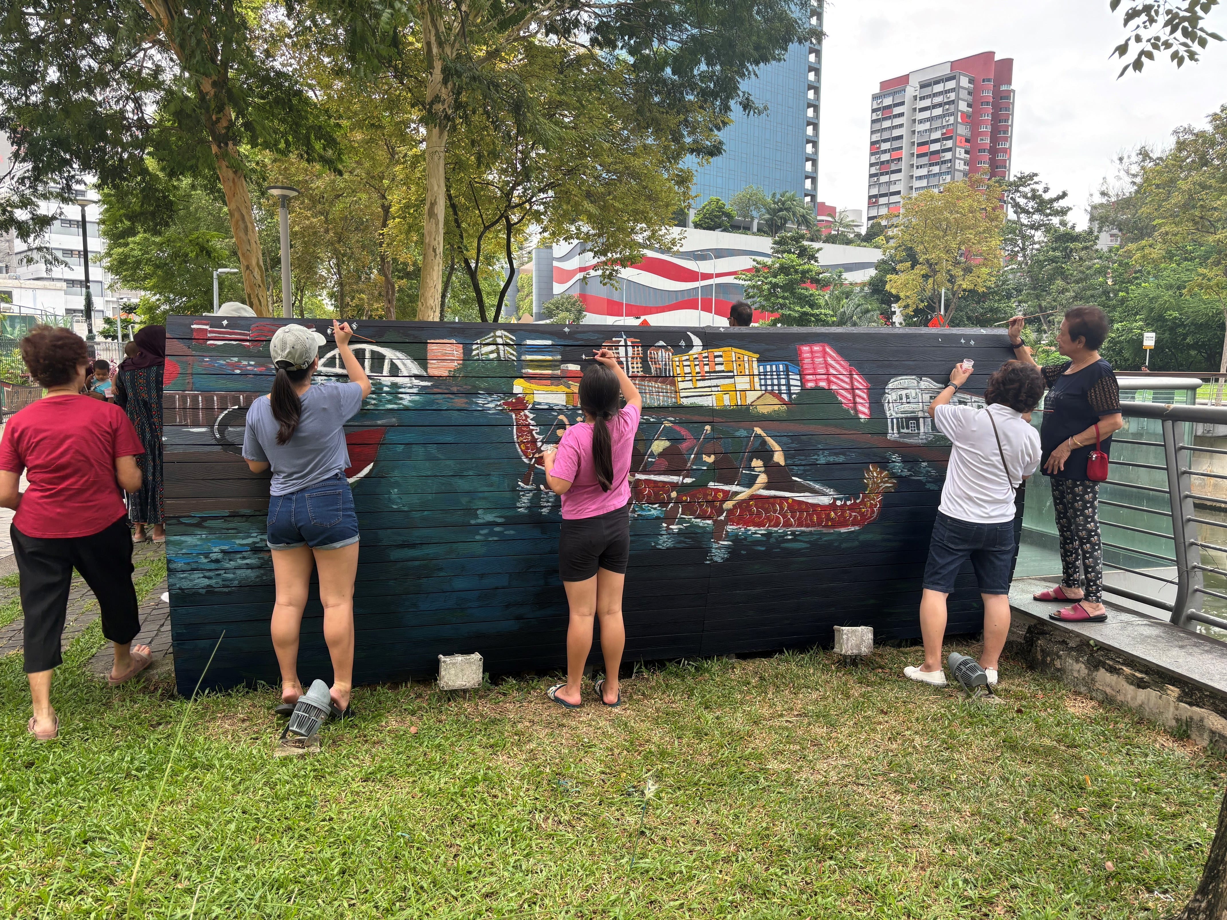 Residents coming together to add colour and life to a shared space at Jalan Berseh.